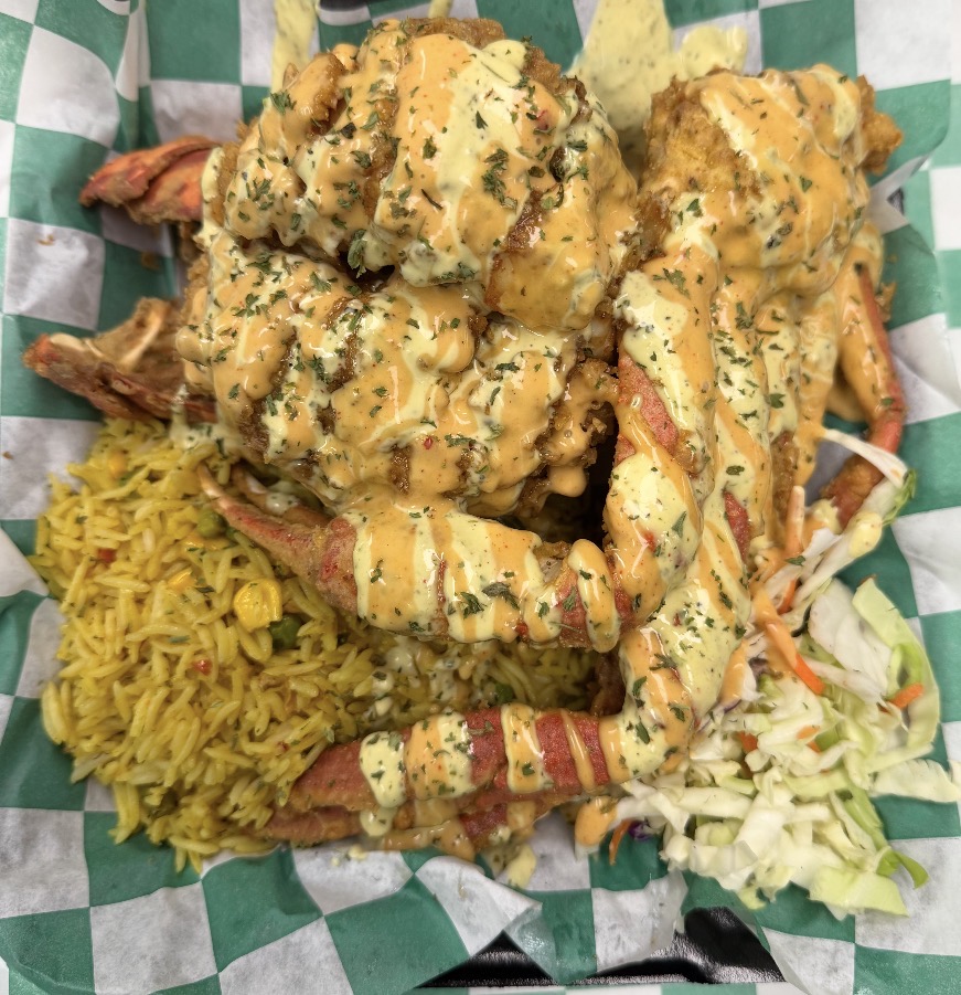 Signature crab and lobster combo drizzled with Ms. B's sauce